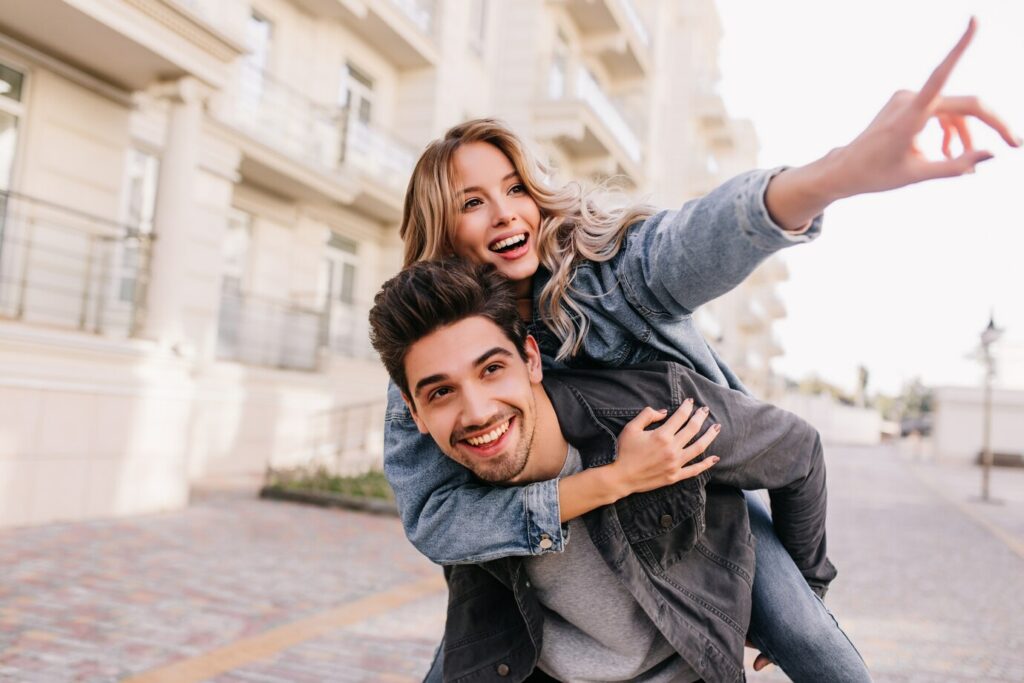 caucasian-pretty-girl-walking-around-city-with-boyfriend-smiling-brunette-man-spending-weekend-with-girlfriend_197531-12261