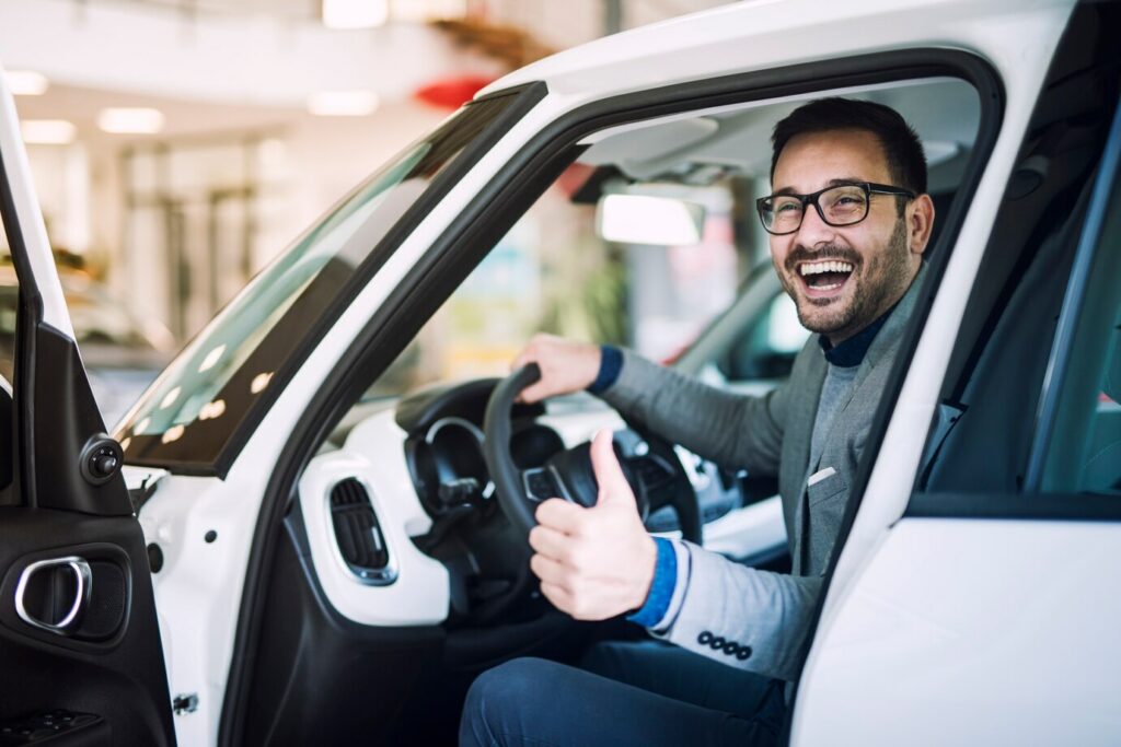 happy-satisfied-customer-just-bought-brand-new-car-vehicle-dealership_342744-720